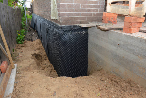 Happy homeowners after waterproofing job in Ijamsville